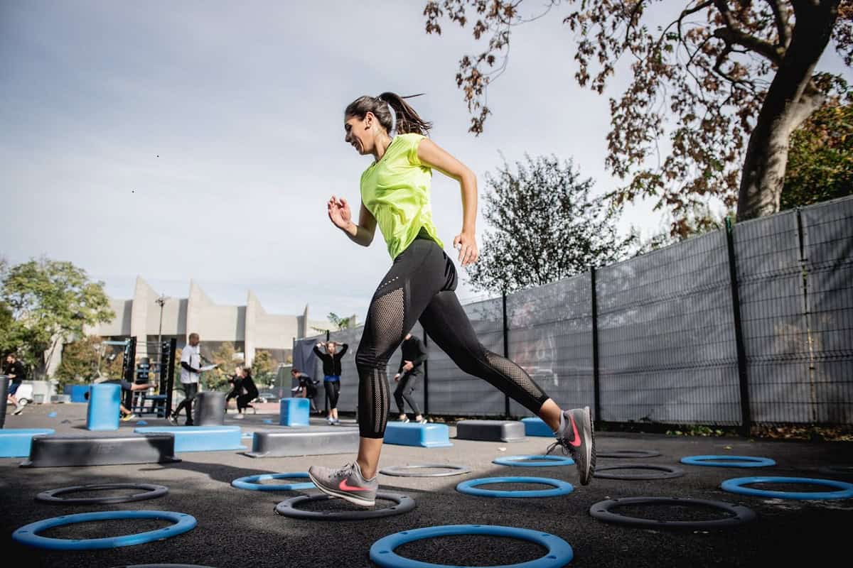 Young woman jogging outdoors during morning workout for physical fitness